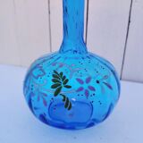 Vintage twisted blue glass carafe with enamel decoration.