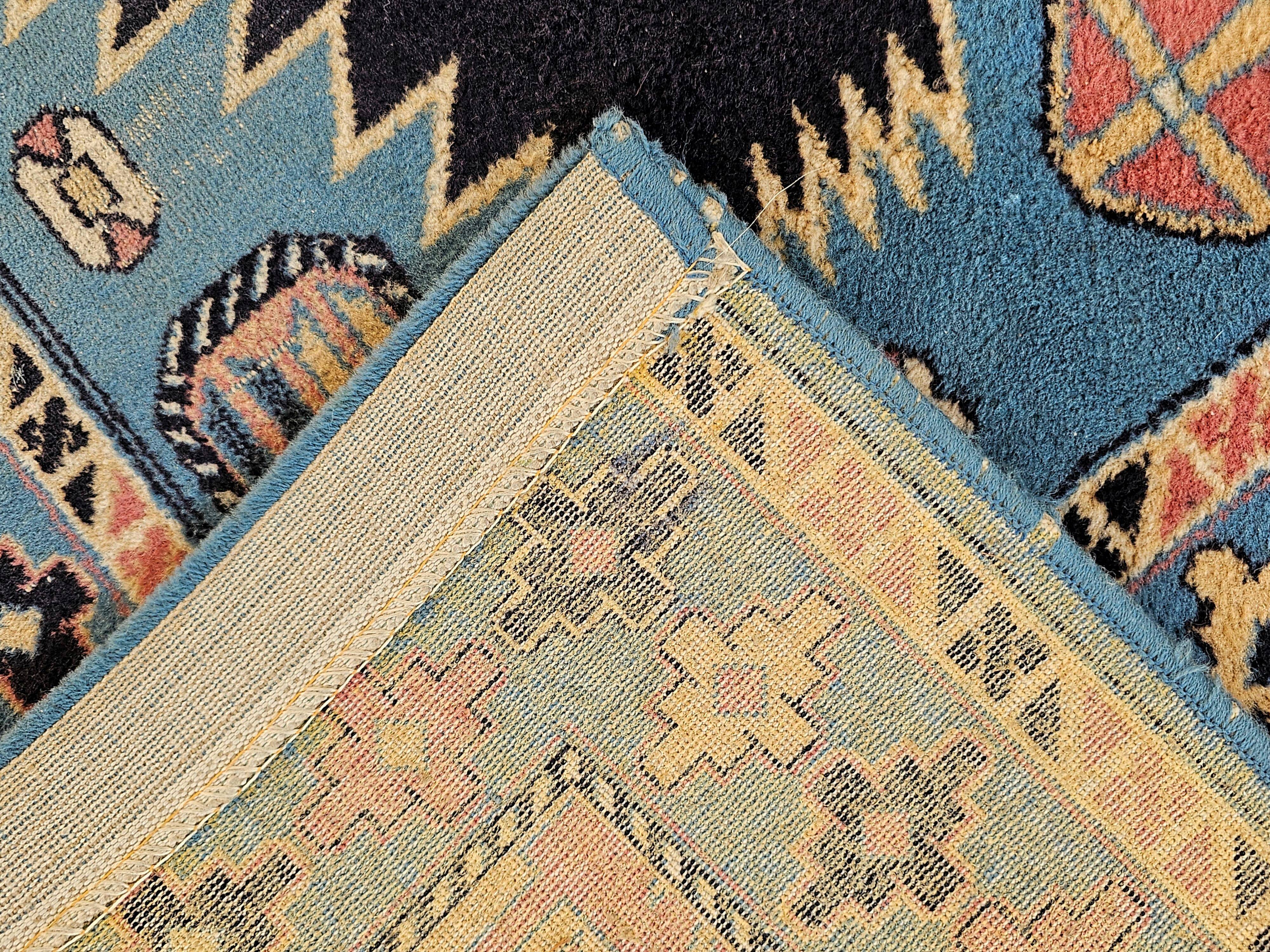 Vintage Kazak rug with geometric oriental motifs, 100% wool.