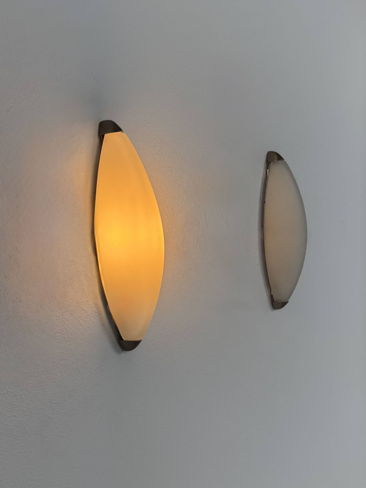 Vintage wall lights, chrome metal and frosted glass, France, 1970.