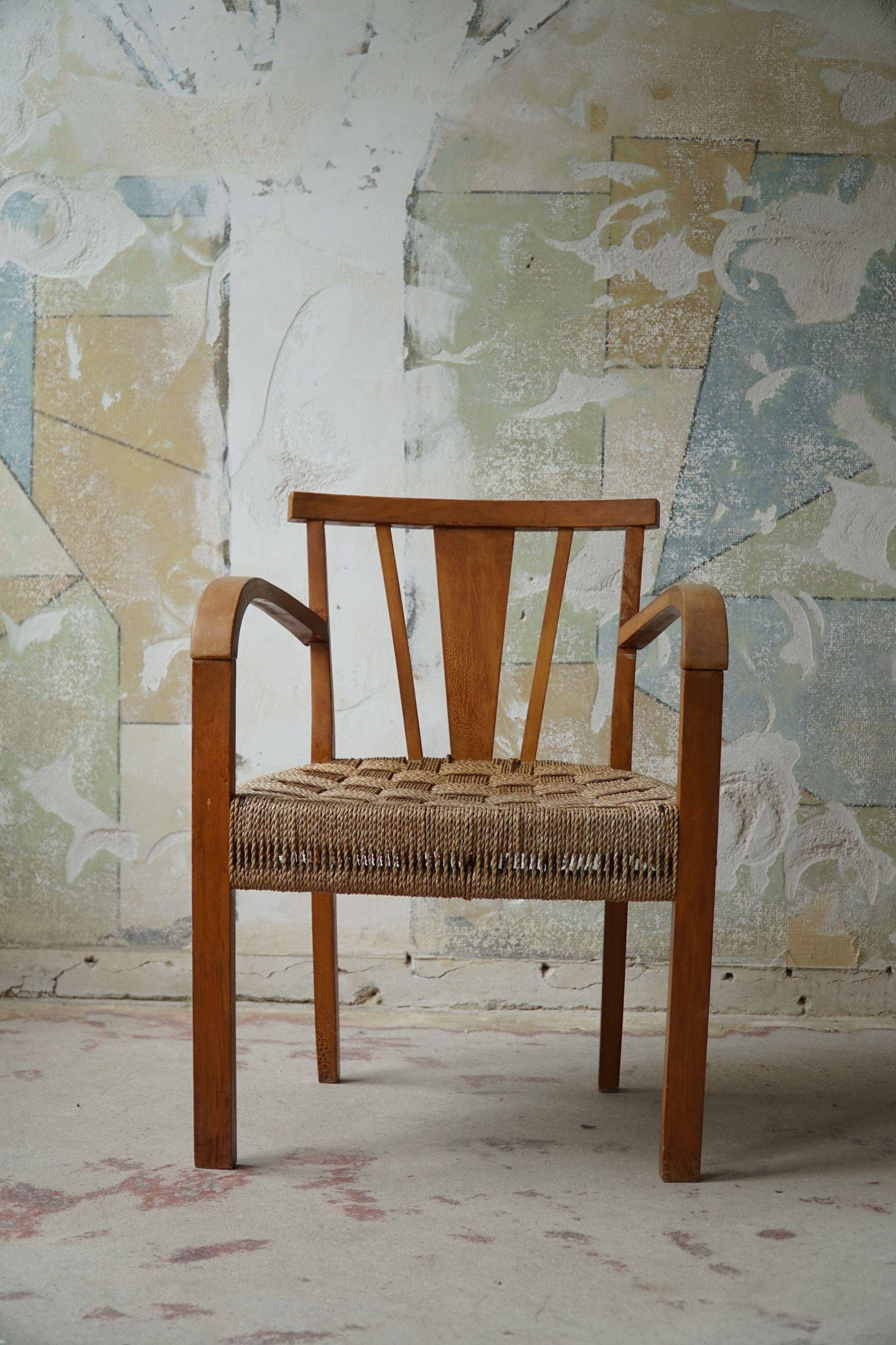 Modern Danish lounge chair in beech and paper cord, in the style of Frits Schlegel.