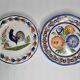 Pair of Henriot Quimper flat plates decorated with rooster and flowers
