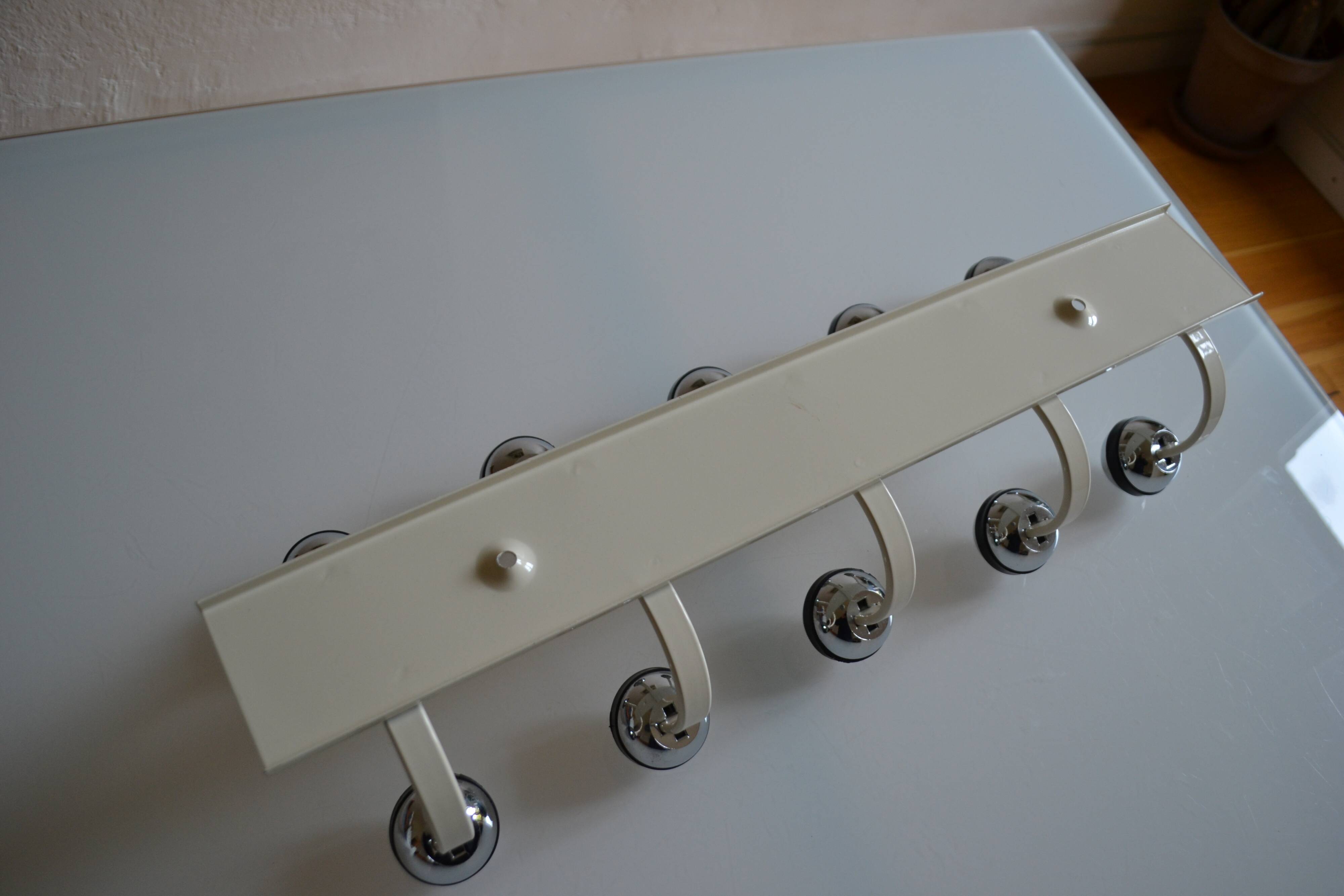 Vintage 1970s wall-mounted coat rack with 10 hooks