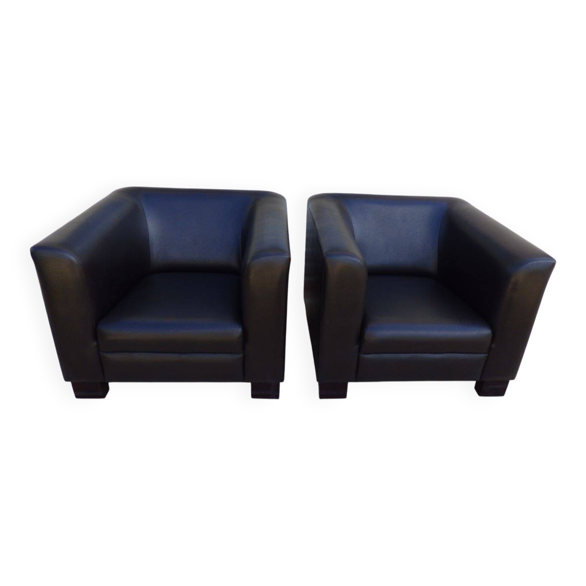 2 club armchairs with a chocolate faux leather seat and backrest and wooden legs.