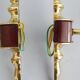Golden wall lamps with round glass shades and teak veneer