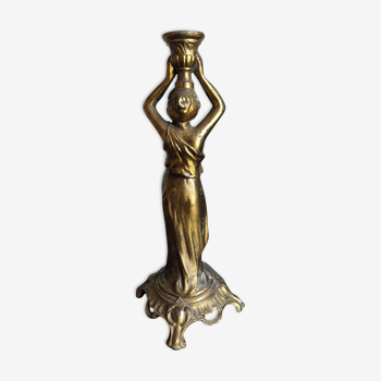 Old candle holder regulates on the subject of a water carrier.
