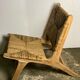 Low armchair in raw teak with seat and mulched backrest
