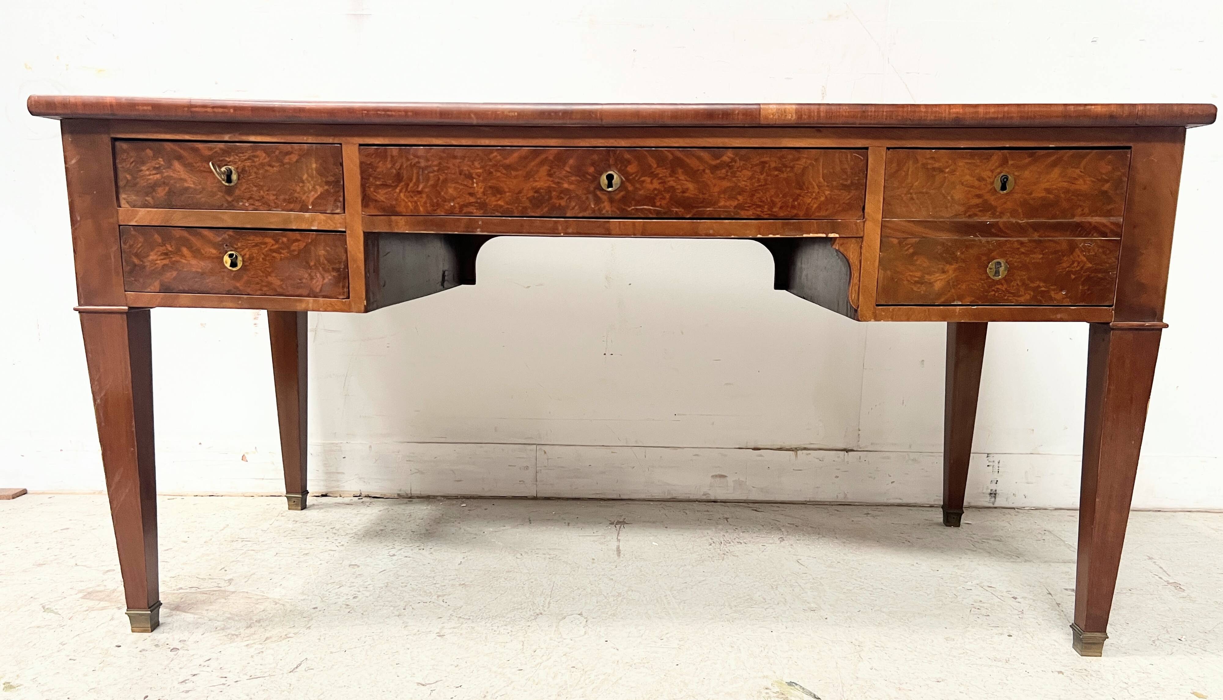 Louis XVI style flat desk in walnut and veneer, 19th century.