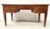 Louis XVI style flat desk in walnut and veneer, 19th century.