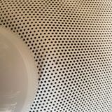 Suspension of the 80s in perforated white metal