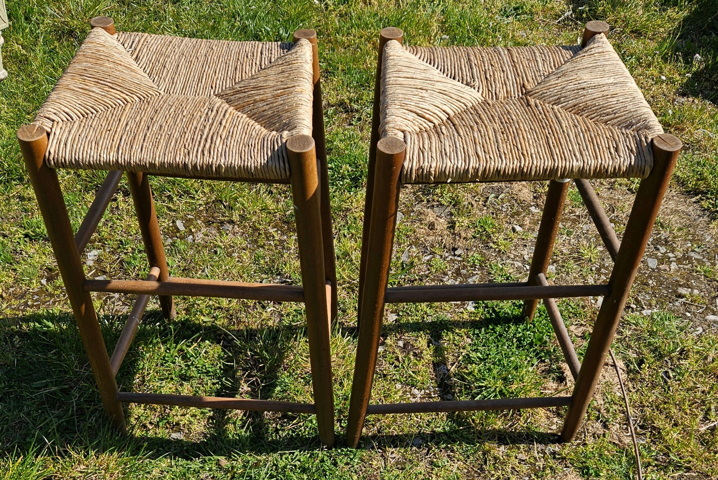 2 high stools sitting straw