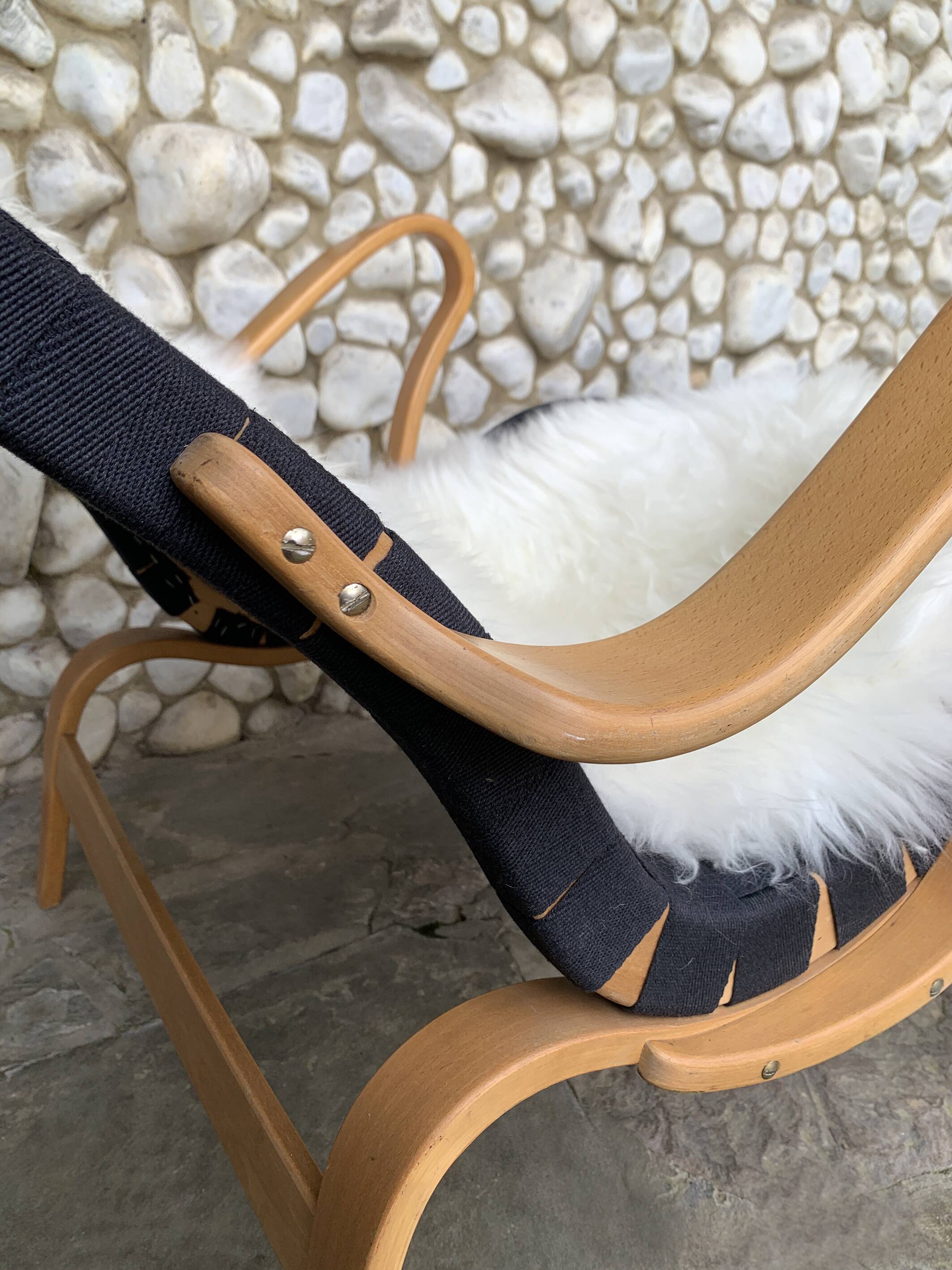 Pernilla armchair in black canvas by Bruno Mathsson, Dux, Sweden 1970