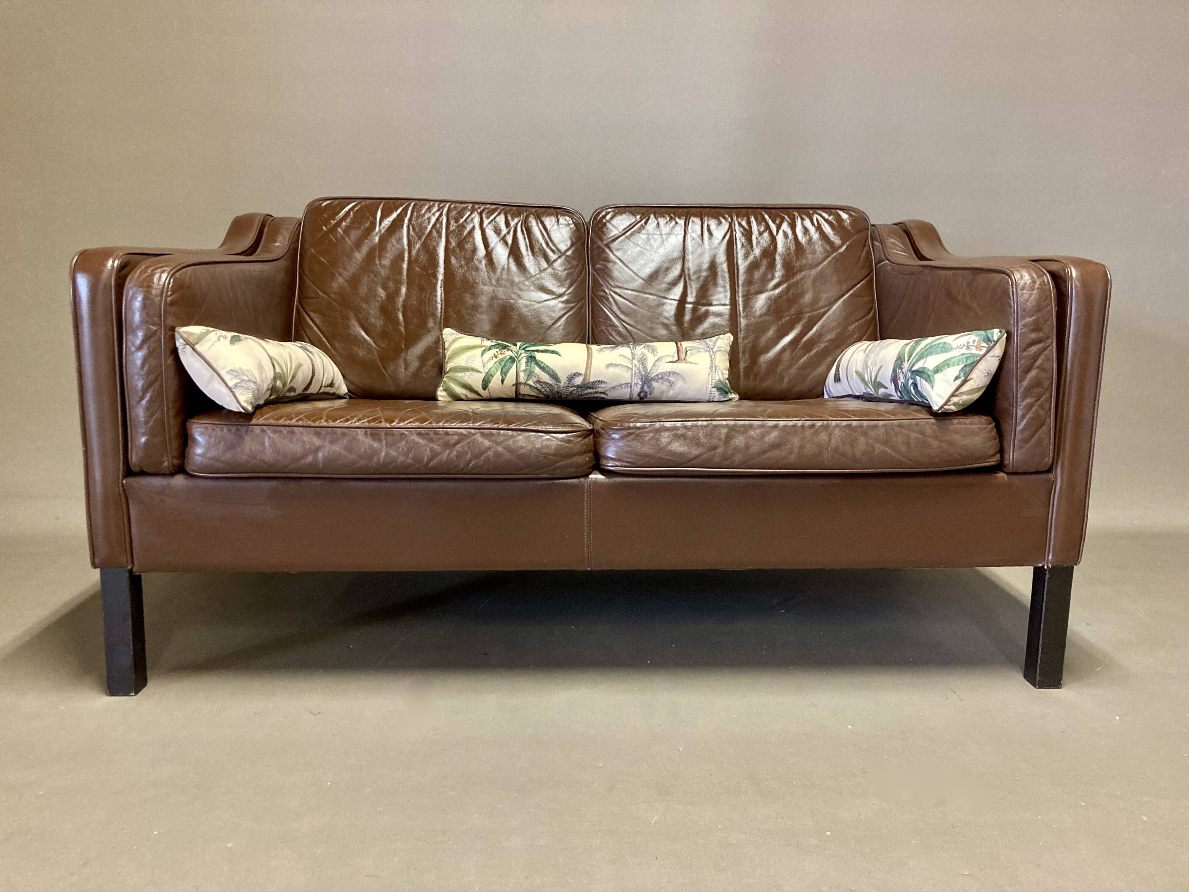 Scandinavian design 2-seater leather sofa.