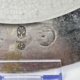 Decorative earthenware and pewter wall plate with spring flowers