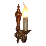 Simple wall sconce in classic Empire style in vintage French bronze.