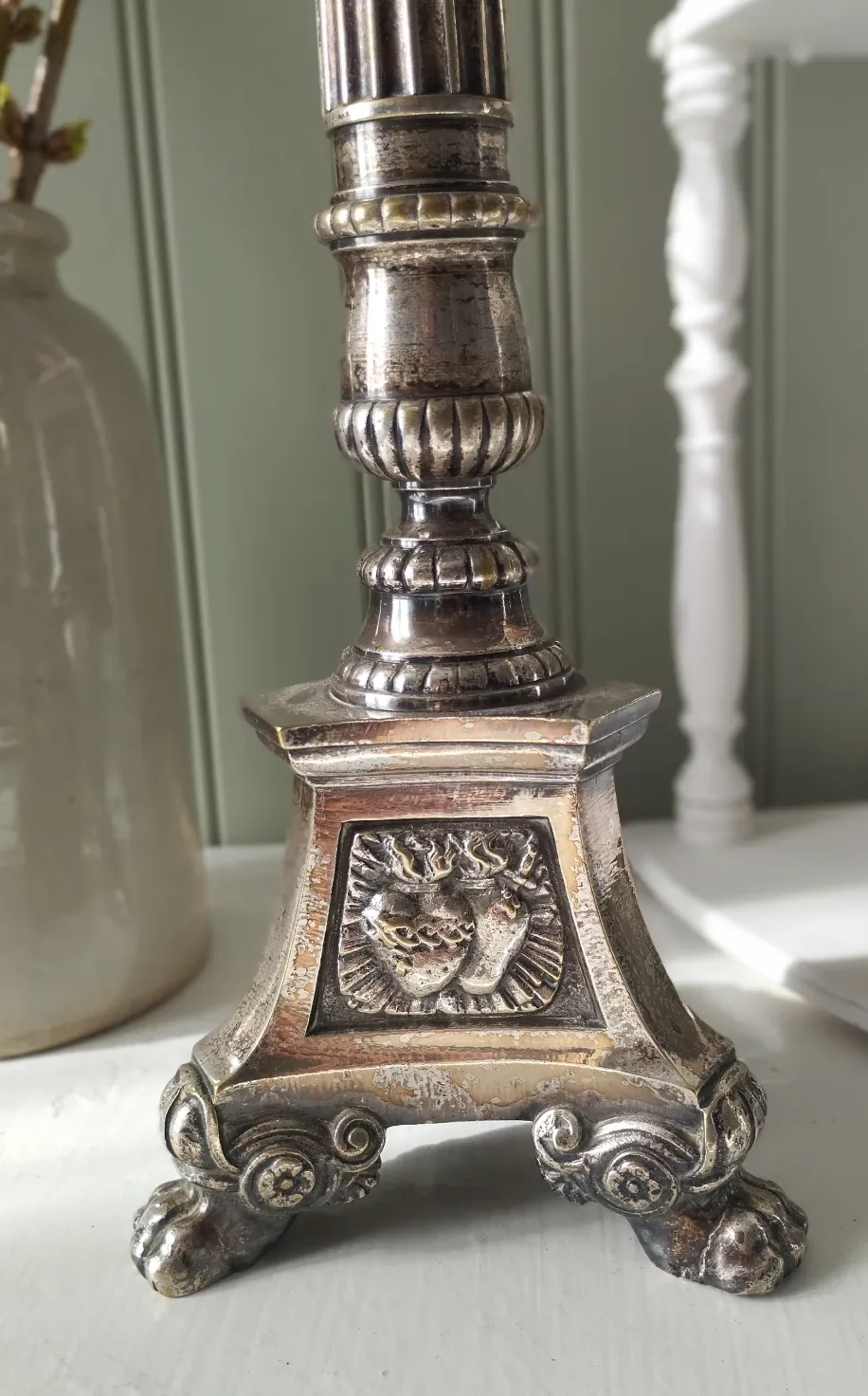 Old church candlestick in silver-plated metal