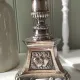 Old church candlestick in silver-plated metal
