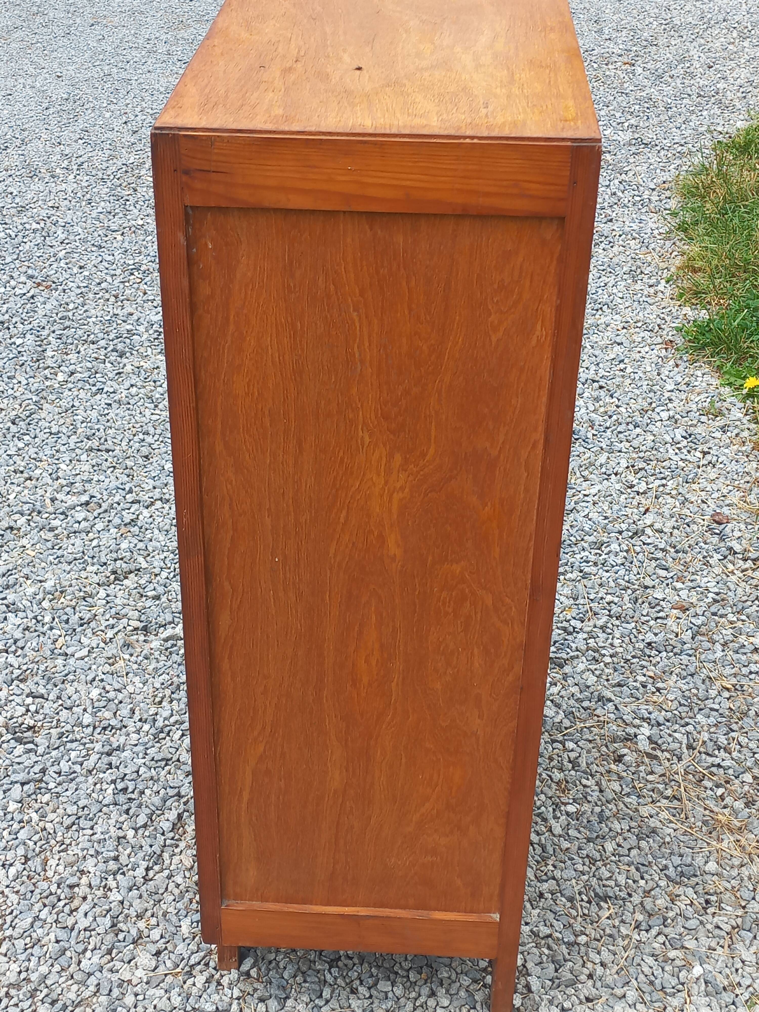 Vintage 1950s chest of drawers with tapered legs and 5 drawers.