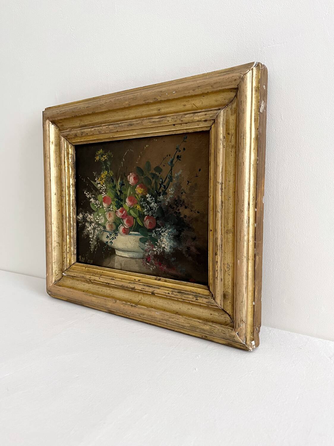 Old oil painting on wood of a bouquet of flowers signed Petit.