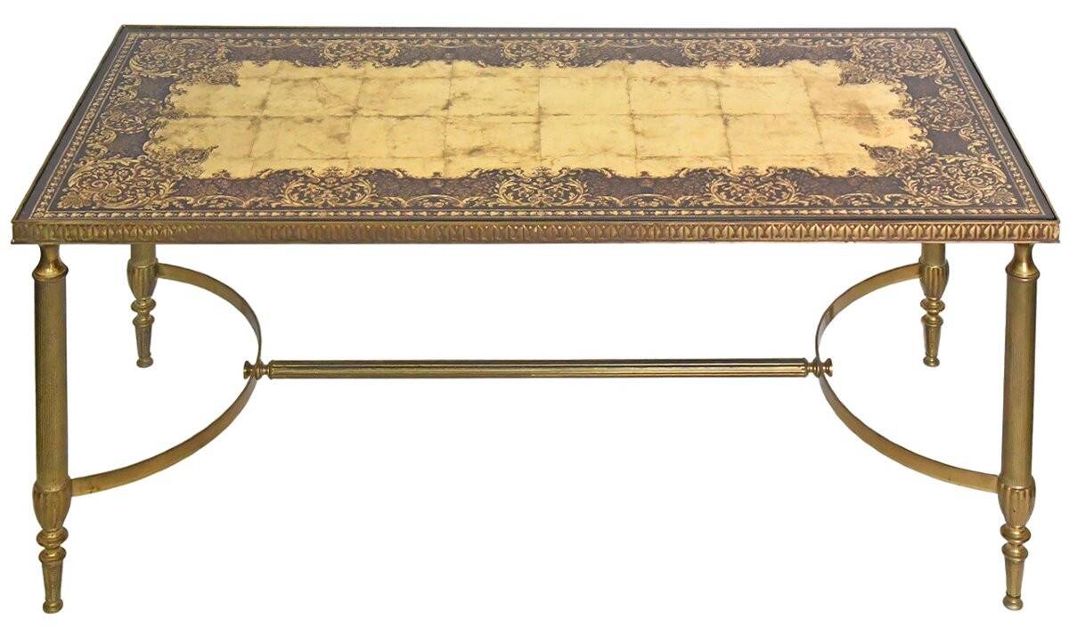 Coffee table in gilded brass with a mirrored eglomisé glass top.