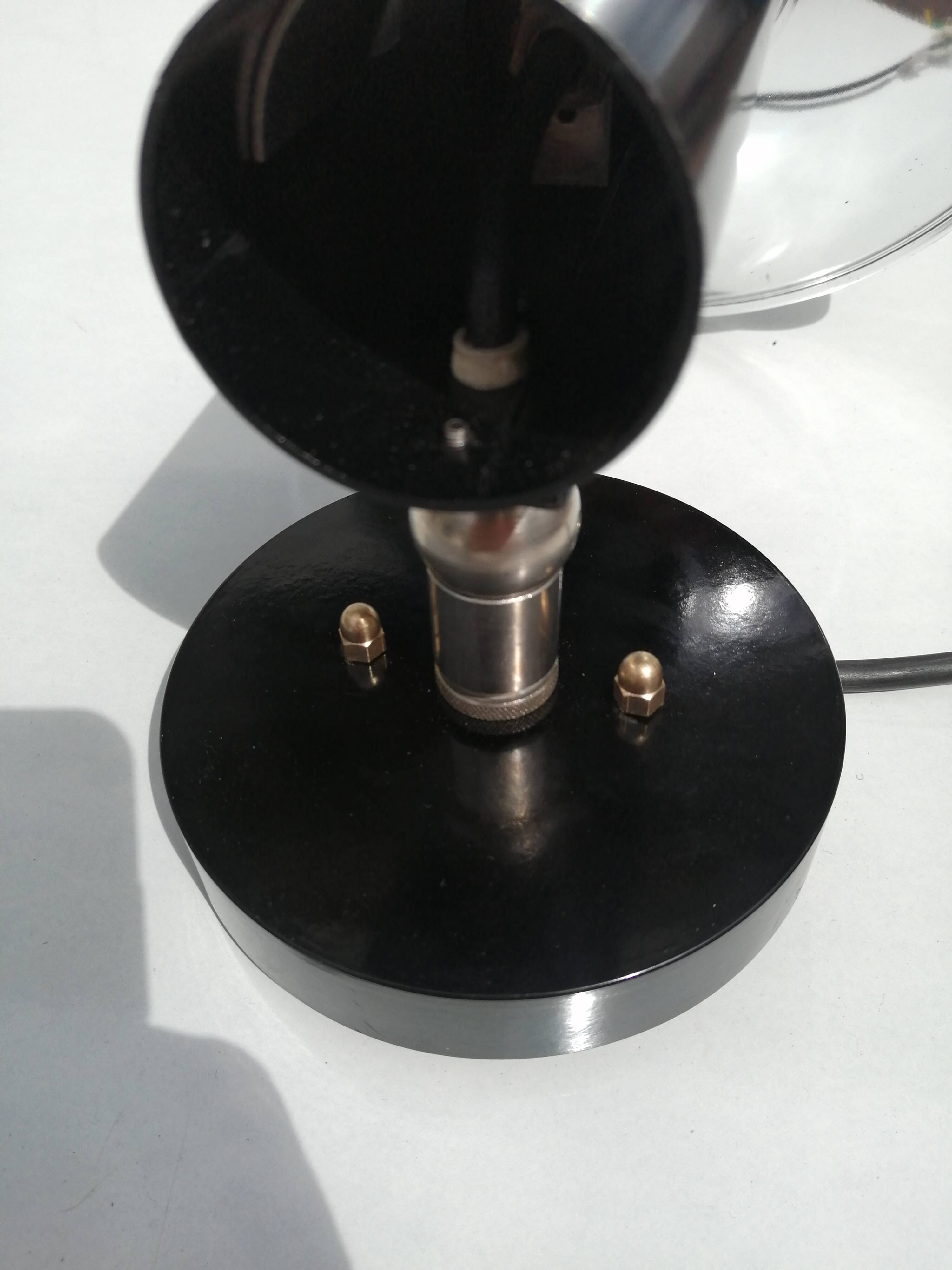 Adjustable black and chrome wall light from Raak, vintage 1960.