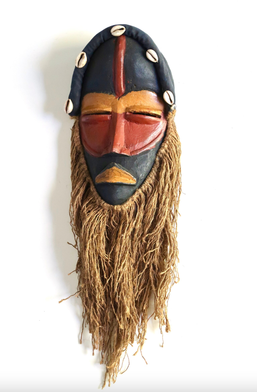 African wooden mask with shells and rope