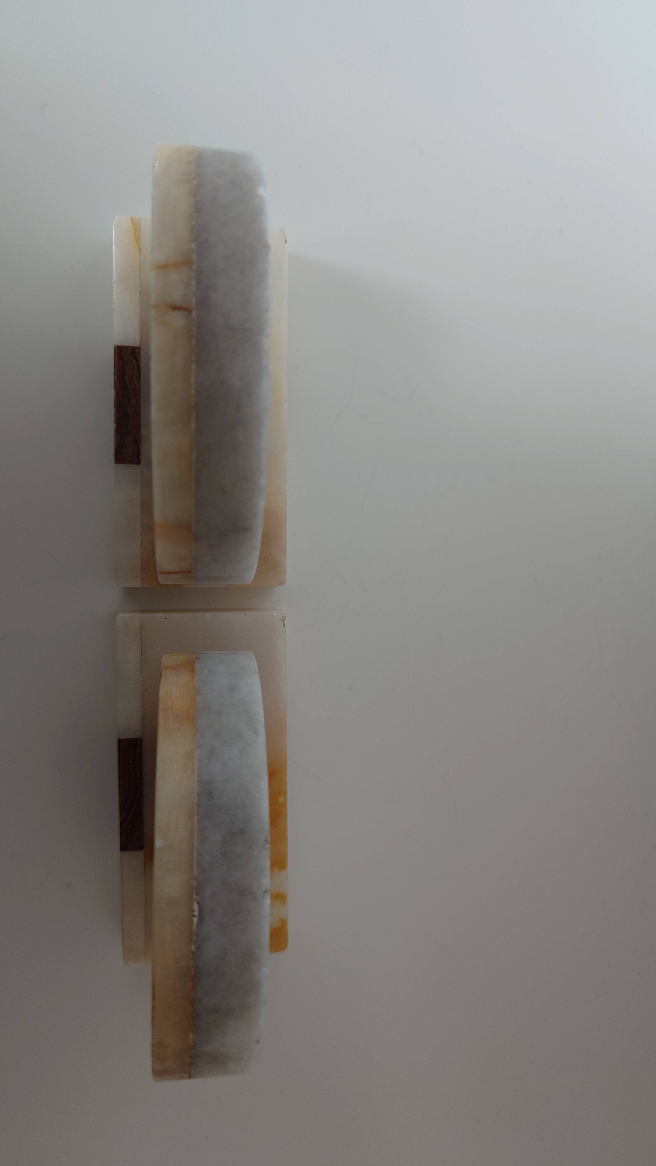 Pair of marble and onyx bookends, geometric design, Art Deco style.