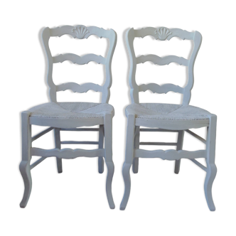 Duo of country-style chairs re-enchanted in pearl gray.