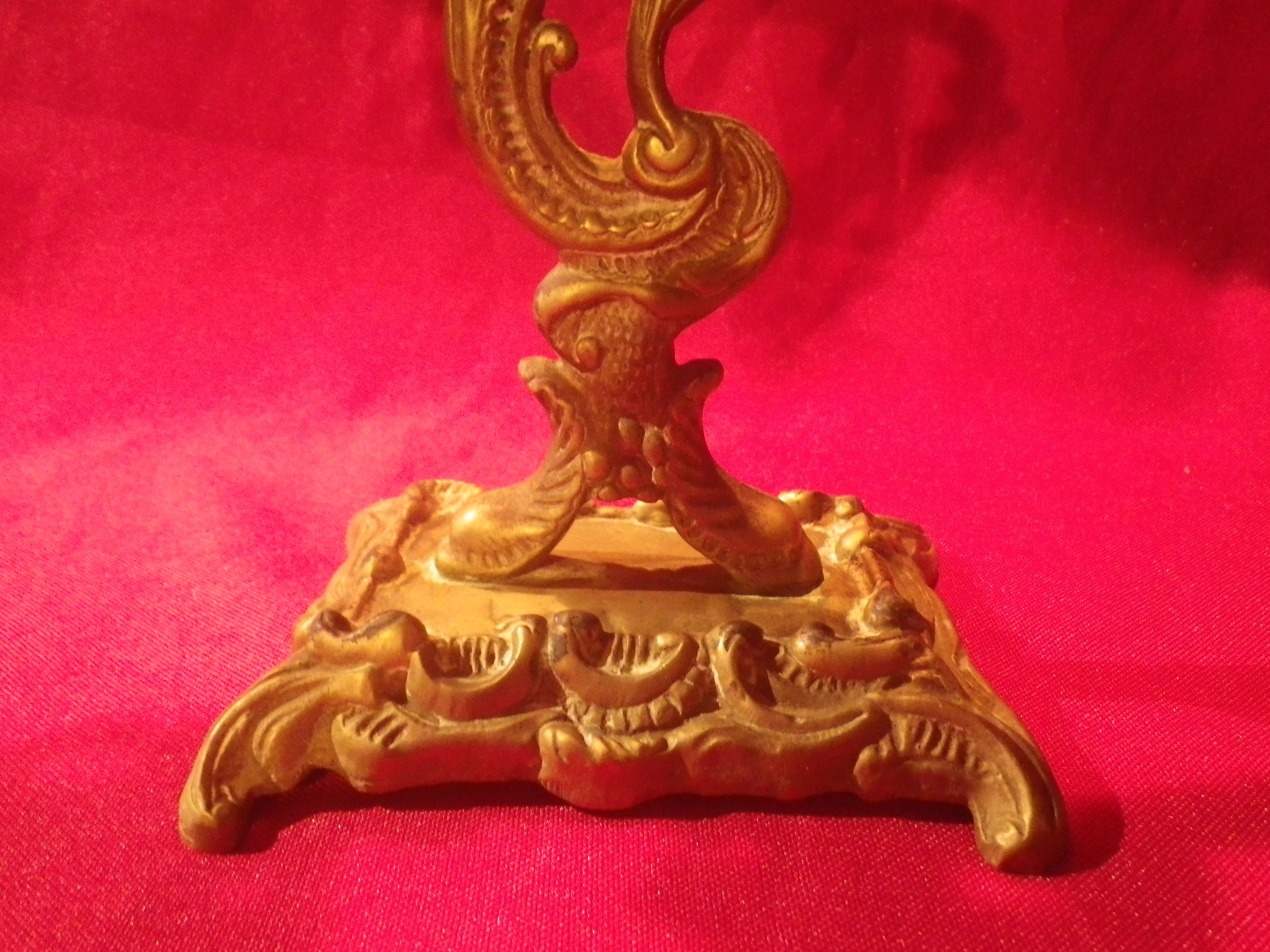 Two brass NCIAN candlesticks