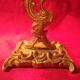 Two brass NCIAN candlesticks