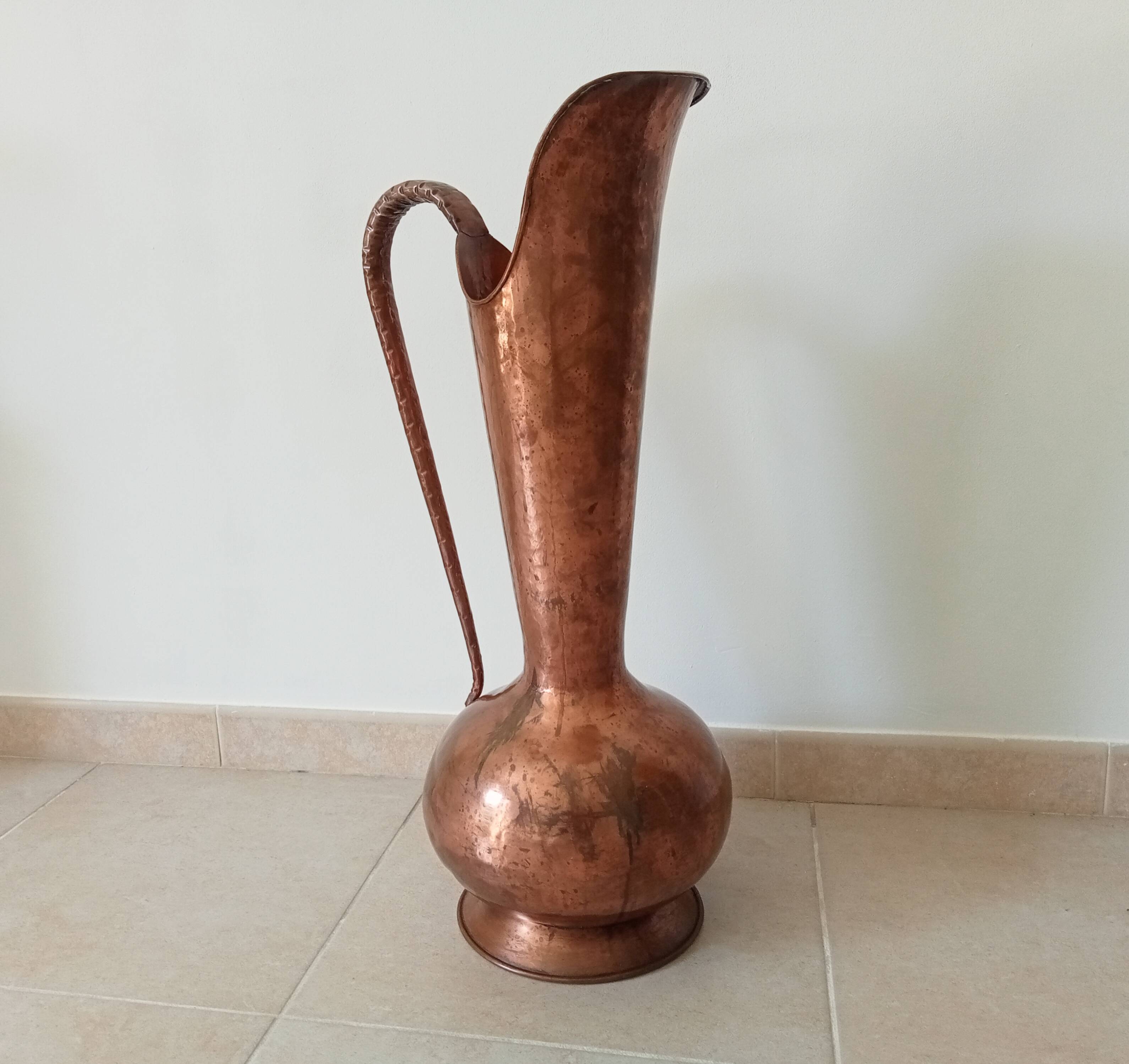 Old italian amphora vase in hammered copper