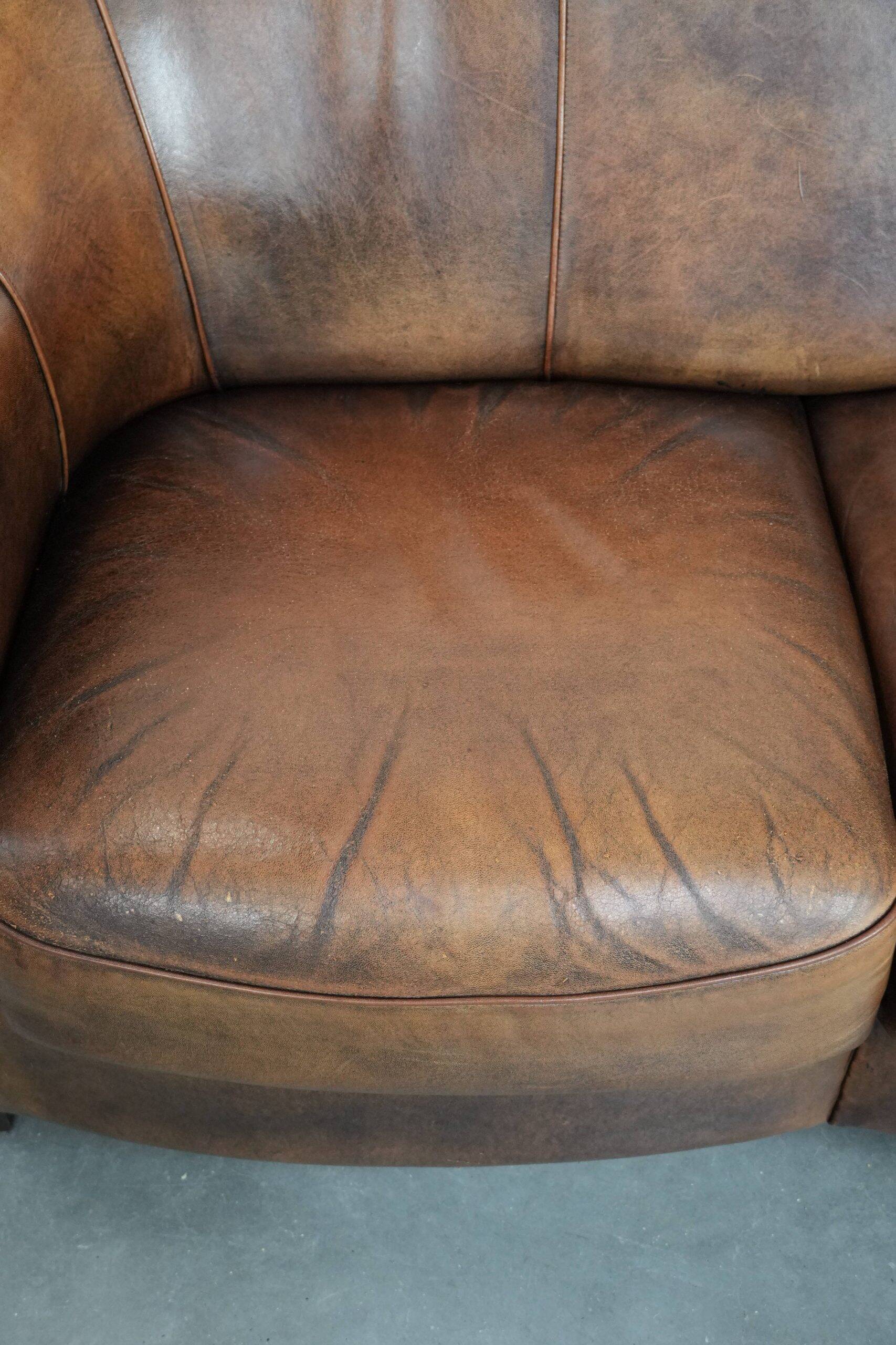 Characterful vintage sturdy 2-seater club sofa made of sheepskin leather