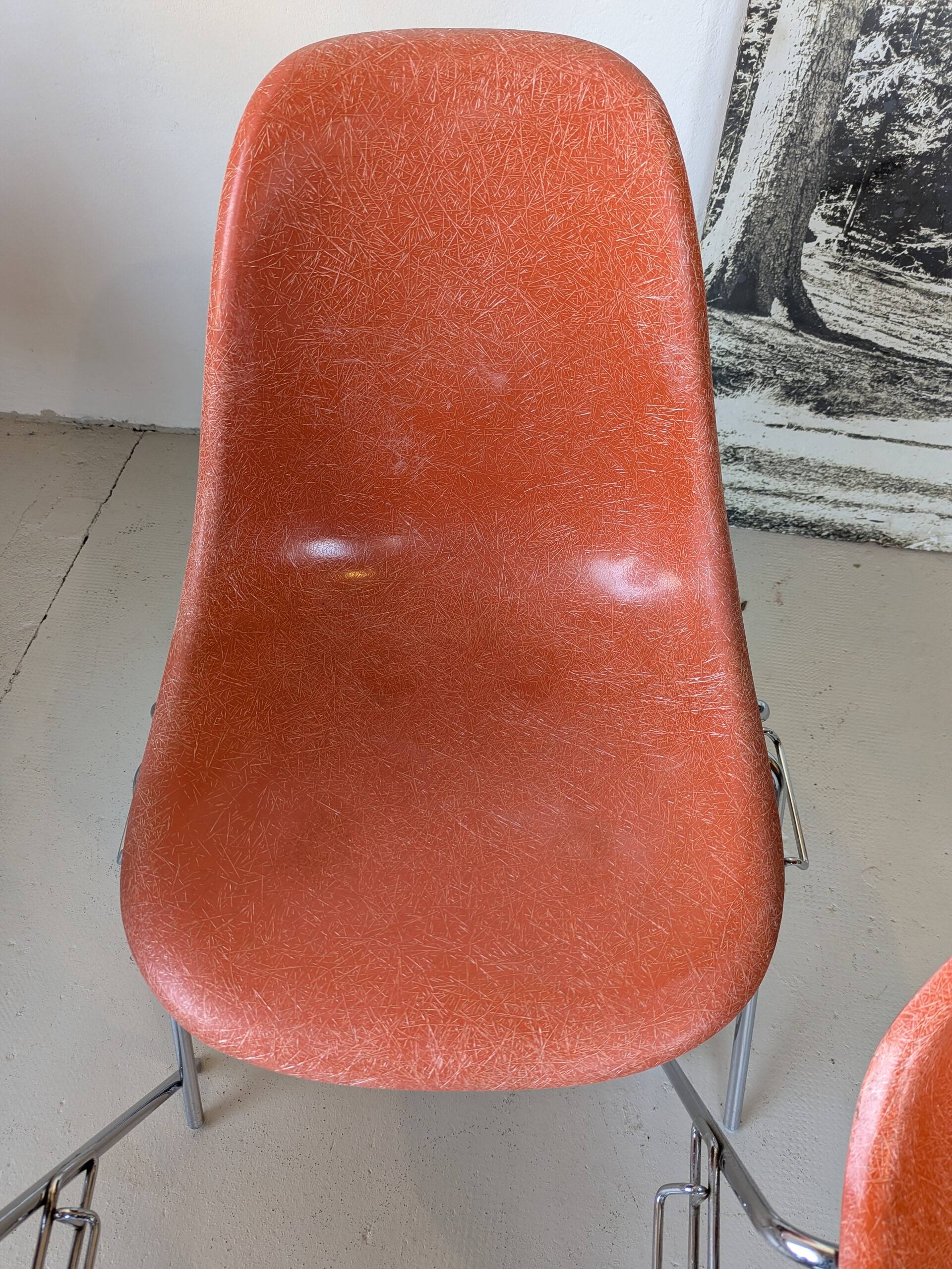 4 DSS model chairs designed by Charles & Ray Eames, orange fiberglass