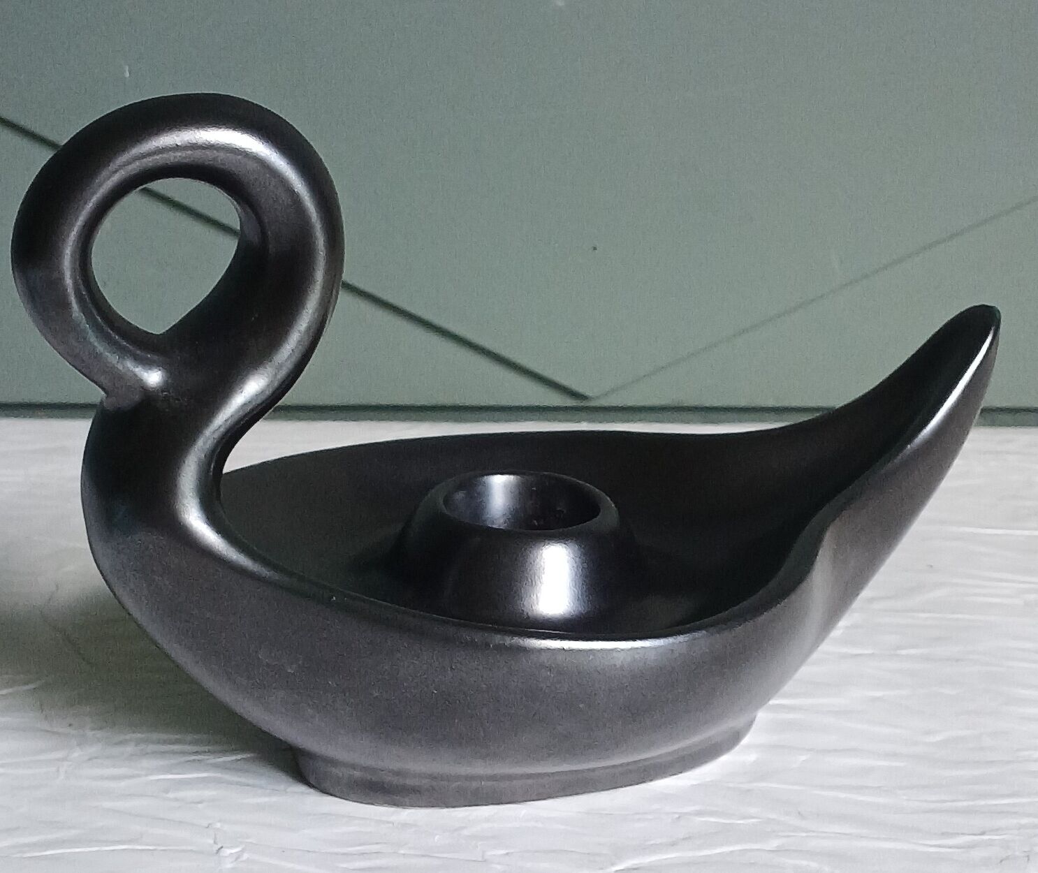 Zoomorphic swan candlestick in black glazed ceramic, Italy circa 1950.