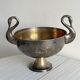 Large champagne bucket with patinated metal swan handles.