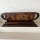 Art Deco jardinière in carved wood, decorated with roses.