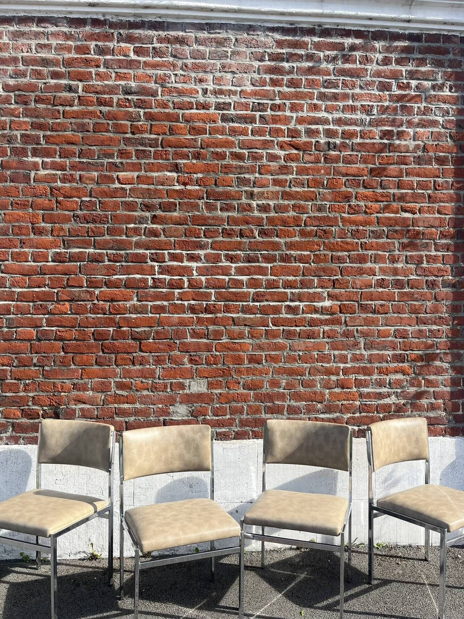 Set of 4 vintage chairs in chrome and faux leather.