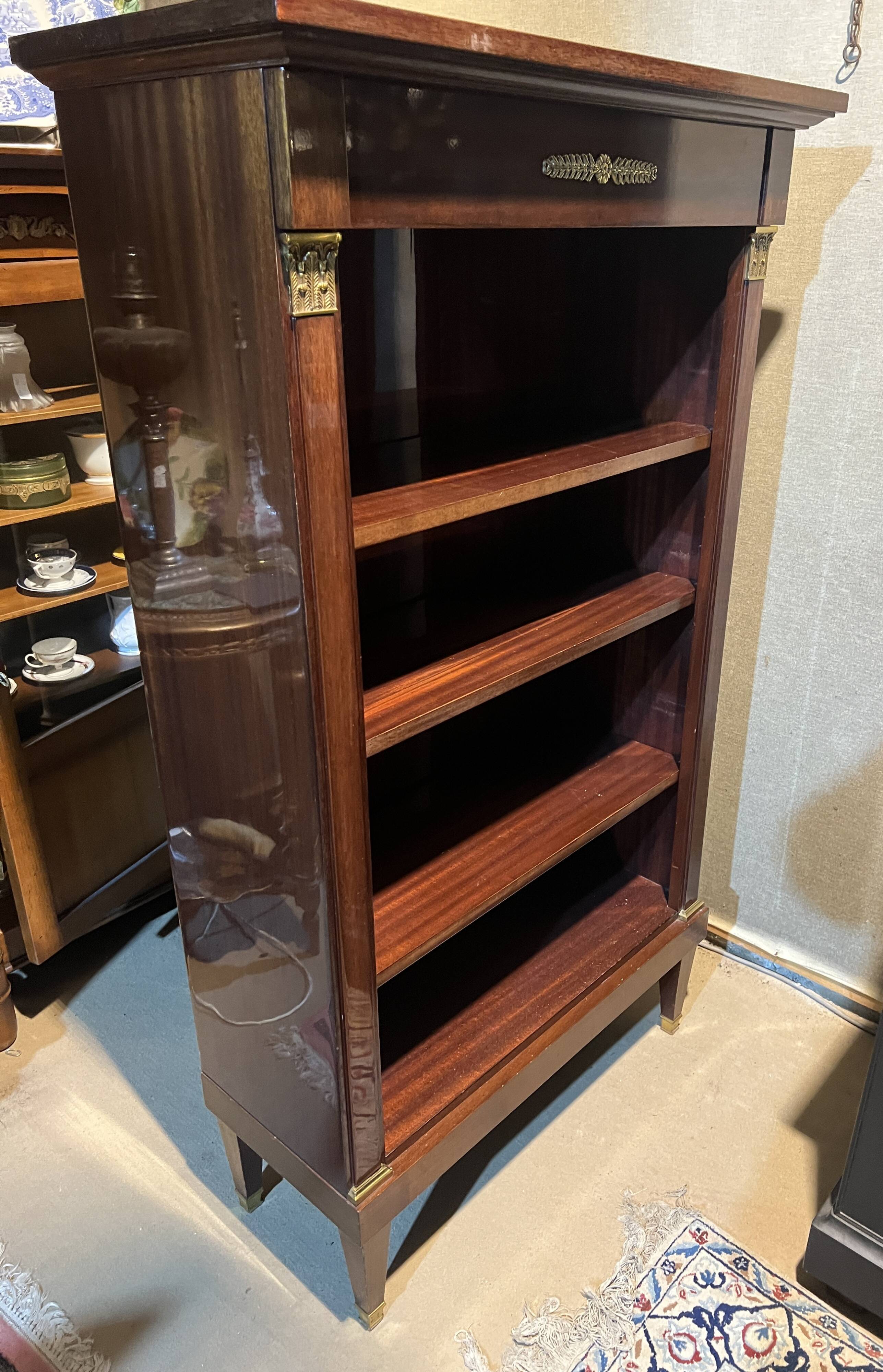 Directoire style bookcase in mahogany, decorated with gilded bronze.