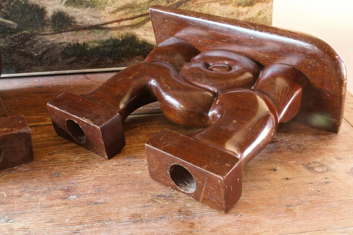 Pair of Art Deco carved wood candlesticks, signed Delaporte