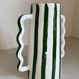 Green and white striped ceramic vase with abstract handmade corrugated handheld