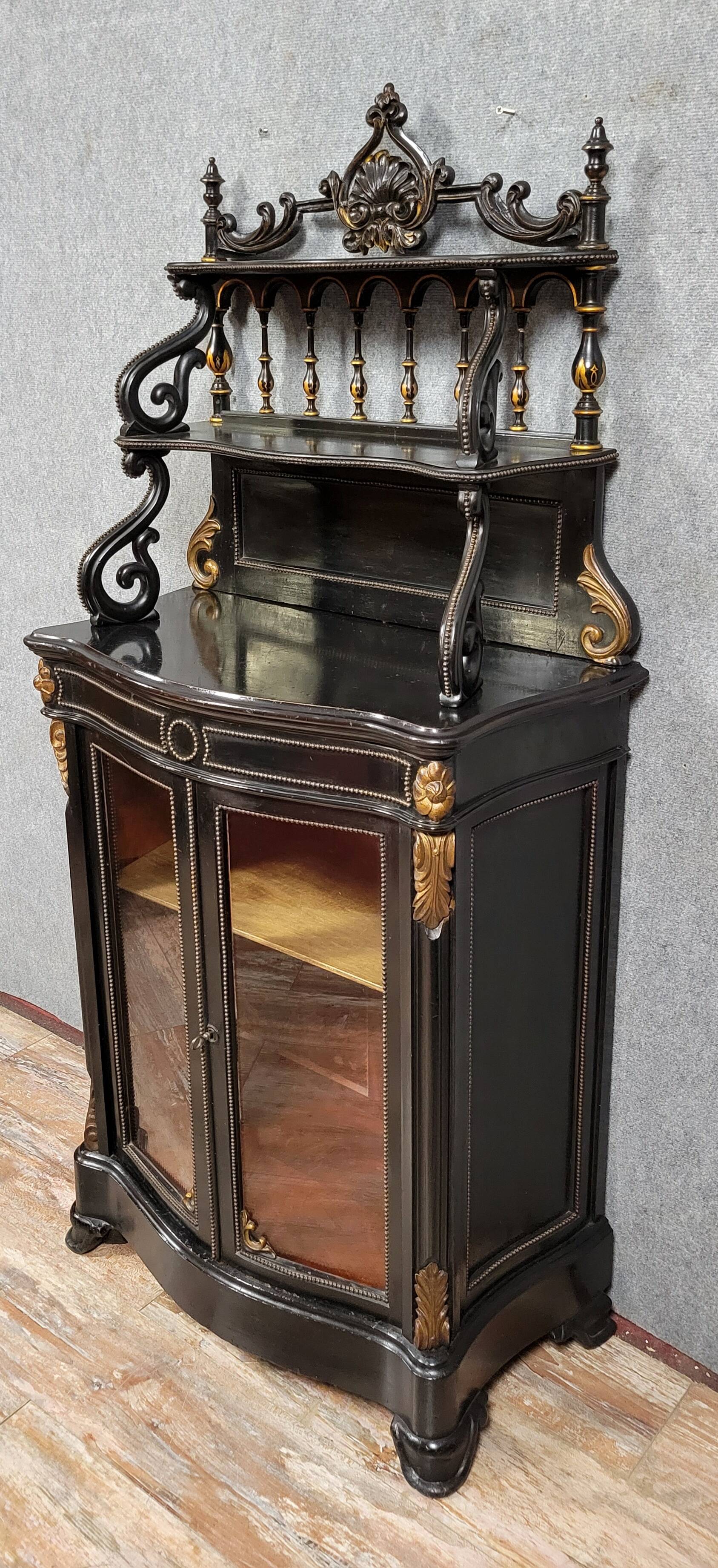 Curved "Boulle" display case from the Napoleon III period in blackened and gilded wood