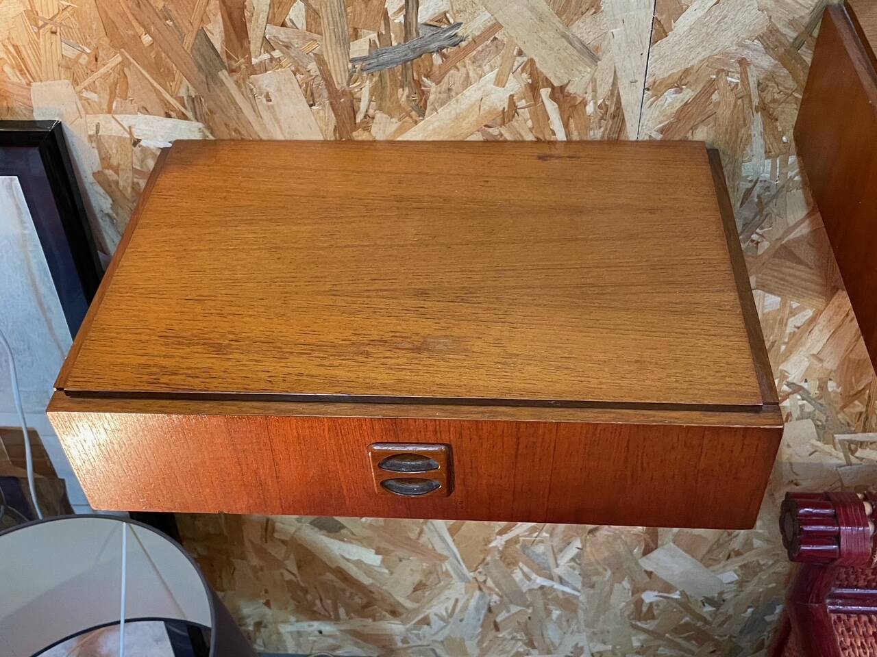 Suspended teak bedside tables in vintage 1960s Scandinavian style.