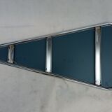 Designer mirror in the shape of a triangle from the 70's, a real Space Age