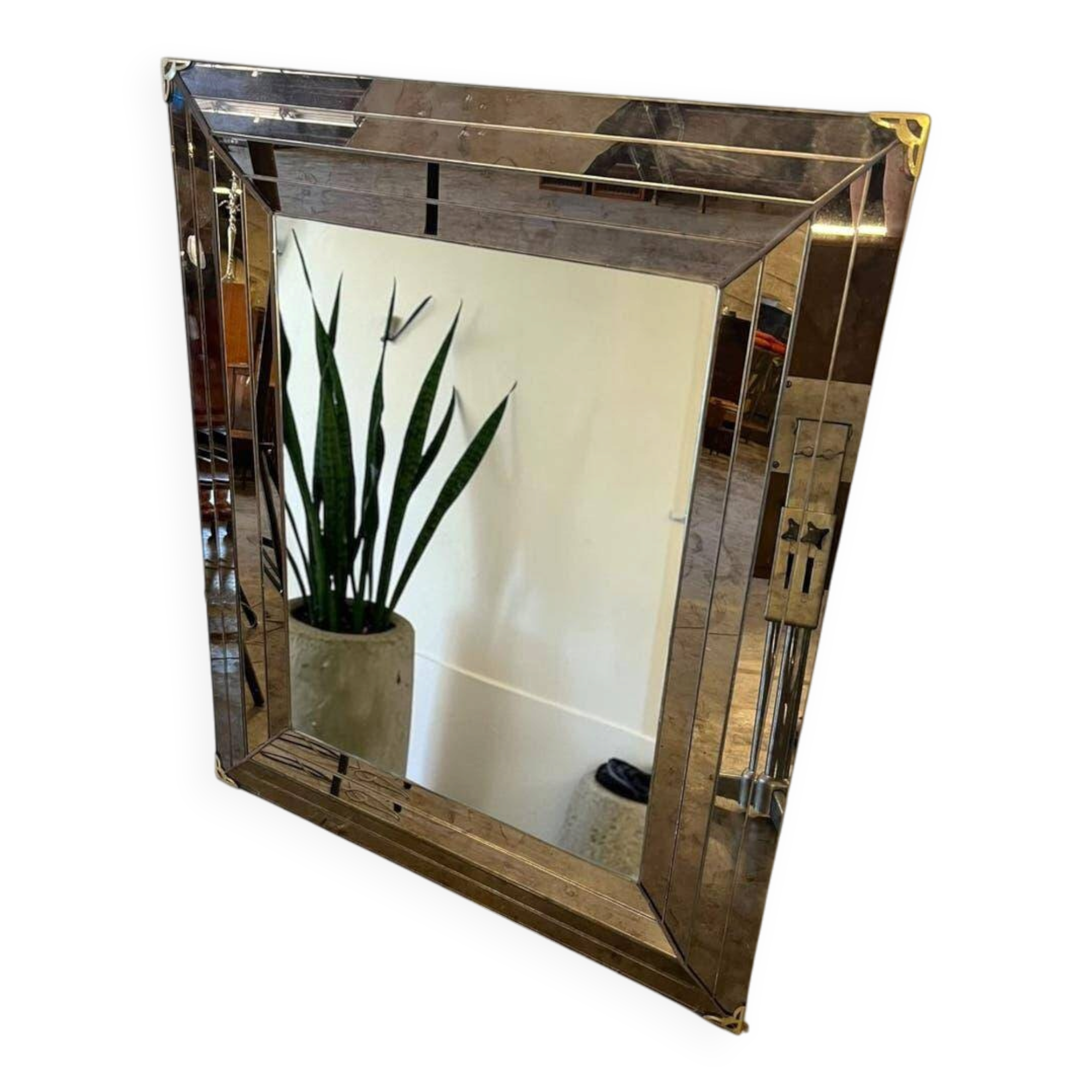 Vintage gold wall mirror with a smoked mirror border.