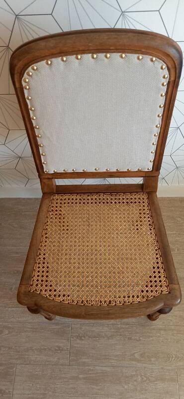 Solid oak art deco chair with cane and fabric.