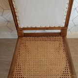Solid oak art deco chair with cane and fabric.