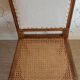 Solid oak art deco chair with cane and fabric.