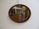 Miroir ovale en acajou ancien