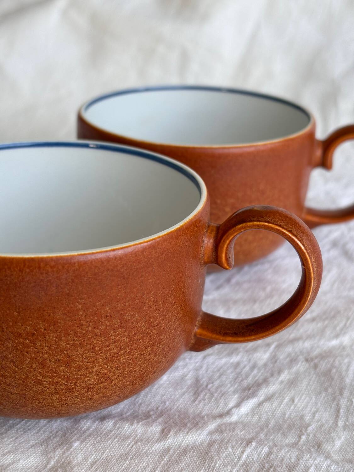 2 very and earthenware coffee cups
