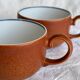 2 very and earthenware coffee cups