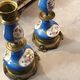 Pair of xixth candle holders, in bronze and enamelled porcelain